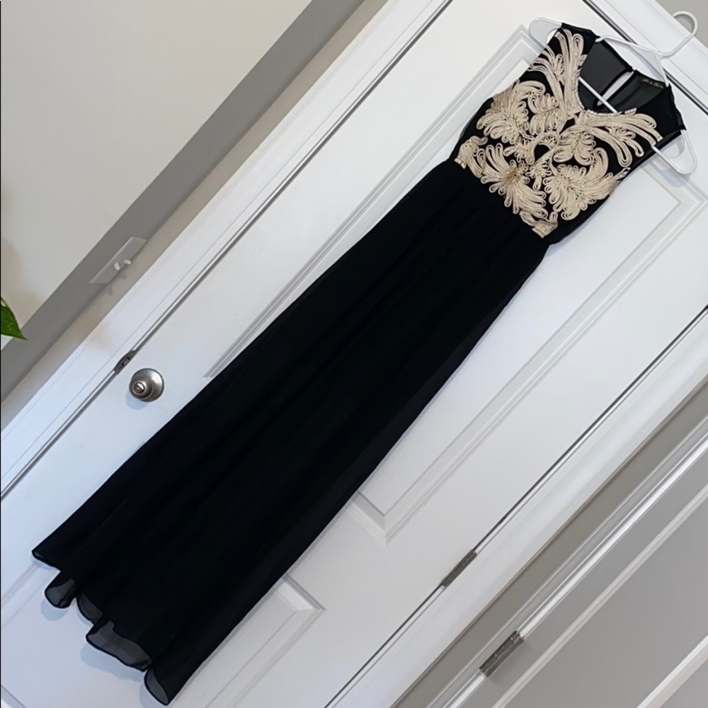 Detailed beautiful long black dress with slits